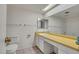 Neutral bathroom with a long vanity and shower/tub combo at 8741 W Osborn Rd, Phoenix, AZ 85037
