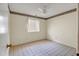 Cozy bedroom with neutral walls, tile floor, and bright window at 8741 W Osborn Rd, Phoenix, AZ 85037