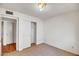 Bedroom with neutral color scheme and tile flooring and closet at 8741 W Osborn Rd, Phoenix, AZ 85037