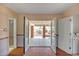 Open living area with French doors leading to a covered patio and backyard at 8741 W Osborn Rd, Phoenix, AZ 85037