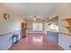 Large living room with wood flooring, traditional decor, and ample natural light at 8741 W Osborn Rd, Phoenix, AZ 85037