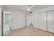 Bright main bedroom with tile floors and an ensuite bathroom at 8741 W Osborn Rd, Phoenix, AZ 85037