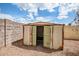 Backyard shed with open double doors at 8741 W Osborn Rd, Phoenix, AZ 85037
