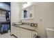 Well-lit bathroom with granite countertop and open closet for ample storage at 9413 W Williams St, Tolleson, AZ 85353