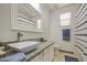 Bathroom featuring granite countertop, modern sink, and ample natural light at 9413 W Williams St, Tolleson, AZ 85353