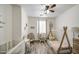 Charming Bedroom with whimsical decor, unique bed, and cozy seating at 9413 W Williams St, Tolleson, AZ 85353