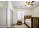 Bedroom with a bed, wooden headboard, and bedside table with lamp at 9413 W Williams St, Tolleson, AZ 85353