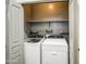 Laundry room showcasing side-by-side Whirlpool washer and dryer units, providing convenience for laundry tasks at 9413 W Williams St, Tolleson, AZ 85353