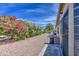Backyard with gravel ground covering, outdoor grill, a small patio, and desert plant life at 964 Leisure World --, Mesa, AZ 85206
