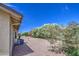 Landscaped backyard with desert flora and fauna, gravel ground covering, and patio at 964 Leisure World --, Mesa, AZ 85206