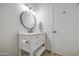 Bathroom featuring a modern vanity, an oval mirror, and storage below at 964 Leisure World --, Mesa, AZ 85206