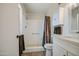 Well-lit bathroom with a shower, vanity, and built-in storage at 964 Leisure World --, Mesa, AZ 85206