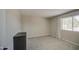 Bedroom with neutral walls, plush carpeting, and a large window at 964 Leisure World --, Mesa, AZ 85206