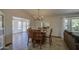 Spacious dining room with a wooden table, chairs, and an open view to the adjacent living spaces at 964 Leisure World --, Mesa, AZ 85206