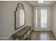 Inviting entryway featuring tile floors, decorative mirror, and frosted glass front door at 964 Leisure World --, Mesa, AZ 85206