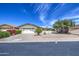 Inviting single-story home featuring desert landscaping, a two-car garage, and an attractive front facade at 964 Leisure World --, Mesa, AZ 85206