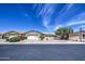 Street view of a lovely single-story home with a two-car garage, desert landscaping, and a welcoming facade at 964 Leisure World --, Mesa, AZ 85206