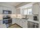 Modern kitchen features stainless appliances, white shaker cabinets, and subway tile backsplash at 964 Leisure World --, Mesa, AZ 85206