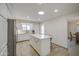 Bright kitchen featuring a center island, stainless steel appliances, and a skylight at 964 Leisure World --, Mesa, AZ 85206