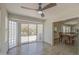 Bright living room with tile floors, slider to backyard, and contemporary ceiling fan at 964 Leisure World --, Mesa, AZ 85206