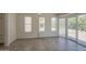 Bright living room with tile floors, three windows, and slider to backyard at 964 Leisure World --, Mesa, AZ 85206