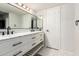 Bathroom featuring dual sinks, marble countertop, matte black fixtures, and hexagon tile floor at 1002 E Topeka Dr, Phoenix, AZ 85024