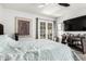 Main bedroom featuring neutral walls, hardwood floors, a ceiling fan, and patio doors at 1002 E Topeka Dr, Phoenix, AZ 85024