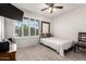 Bedroom with carpet floor, neutral walls, ceiling fan, and a sun-filled window at 1002 E Topeka Dr, Phoenix, AZ 85024