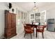 Dining area with light fixture and access to the patio at 1002 E Topeka Dr, Phoenix, AZ 85024