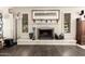 Living room with a white brick fireplace and mantle flanked by shuttered windows at 1002 E Topeka Dr, Phoenix, AZ 85024