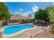 Inviting backyard pool area with brick patio and covered seating, perfect for outdoor relaxation and entertainment at 1002 E Topeka Dr, Phoenix, AZ 85024