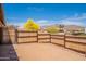 Fenced backyard offering privacy and space with desert landscaping, and views of neighborhood at 10177 E La Palma Ave, Gold Canyon, AZ 85118