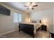 Bedroom with ceiling fan, bedside tables and lamps at 10177 E La Palma Ave, Gold Canyon, AZ 85118