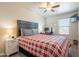 Cozy bedroom with a comfortable bed, desk area, and large window for natural light at 10177 E La Palma Ave, Gold Canyon, AZ 85118