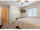 Bedroom with ceiling fan, closet, and television at 10177 E La Palma Ave, Gold Canyon, AZ 85118