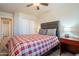 A comfortable bedroom featuring a ceiling fan, wardrobe closet, and two bedside tables at 10177 E La Palma Ave, Gold Canyon, AZ 85118