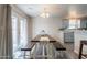 Bright dining room with a wooden table and a view of the backyard at 10177 E La Palma Ave, Gold Canyon, AZ 85118