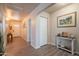 Inviting entryway featuring new flooring, decor, an arched entry and plenty of closet space at 10177 E La Palma Ave, Gold Canyon, AZ 85118
