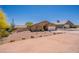 Charming single-story home featuring desert landscaping, a two-car garage, and a well-maintained yard at 10177 E La Palma Ave, Gold Canyon, AZ 85118