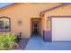 Up close shot of the facade highlighting the house number, front door, and desert decor at 10177 E La Palma Ave, Gold Canyon, AZ 85118