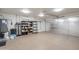 Spacious garage with epoxy flooring, shelving, and a water heater system at 10177 E La Palma Ave, Gold Canyon, AZ 85118