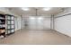 Clean garage featuring an epoxy floor and storage shelving at 10177 E La Palma Ave, Gold Canyon, AZ 85118