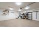 This garage space features an epoxy floor and multiple storage solutions at 10177 E La Palma Ave, Gold Canyon, AZ 85118