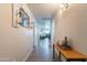Hallway featuring modern lighting, decor, and laminate flooring that opens to the living room at 10177 E La Palma Ave, Gold Canyon, AZ 85118