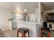 Contemporary kitchen with stainless steel appliances and a breakfast bar at 10177 E La Palma Ave, Gold Canyon, AZ 85118
