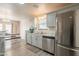 Updated kitchen featuring stainless steel appliances, gray cabinetry, and dining area at 10177 E La Palma Ave, Gold Canyon, AZ 85118