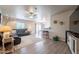 Spacious living room with hardwood floors, ceiling fan, and modern decor at 10177 E La Palma Ave, Gold Canyon, AZ 85118