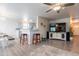 Open-concept living area with hardwood floors and barstool seating at 10177 E La Palma Ave, Gold Canyon, AZ 85118