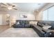 Inviting living room with a large sectional sofa and decorative rug at 10177 E La Palma Ave, Gold Canyon, AZ 85118