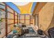 Cozy covered patio with comfortable seating, perfect for outdoor relaxation and entertaining in style at 10177 E La Palma Ave, Gold Canyon, AZ 85118